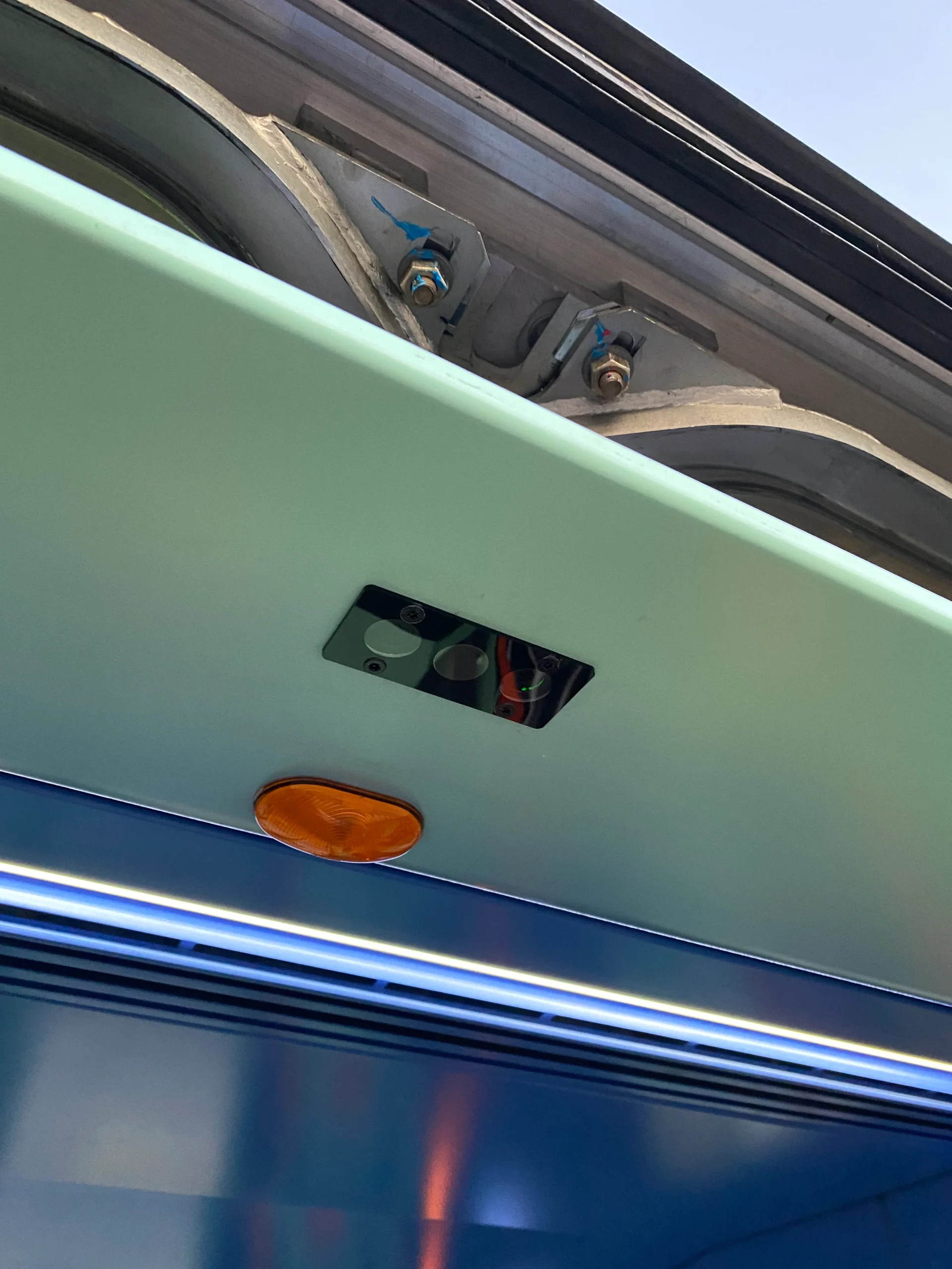 Eyes 3 counting cell installed above bus doors — discreet, compact, precise real-world installation