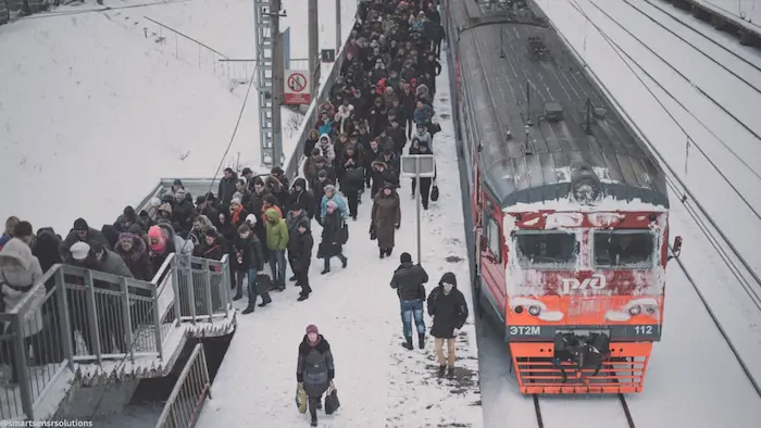 Overcrowded commuter train carriage during rush hour — the consequence of capacity planning without accurate APC data