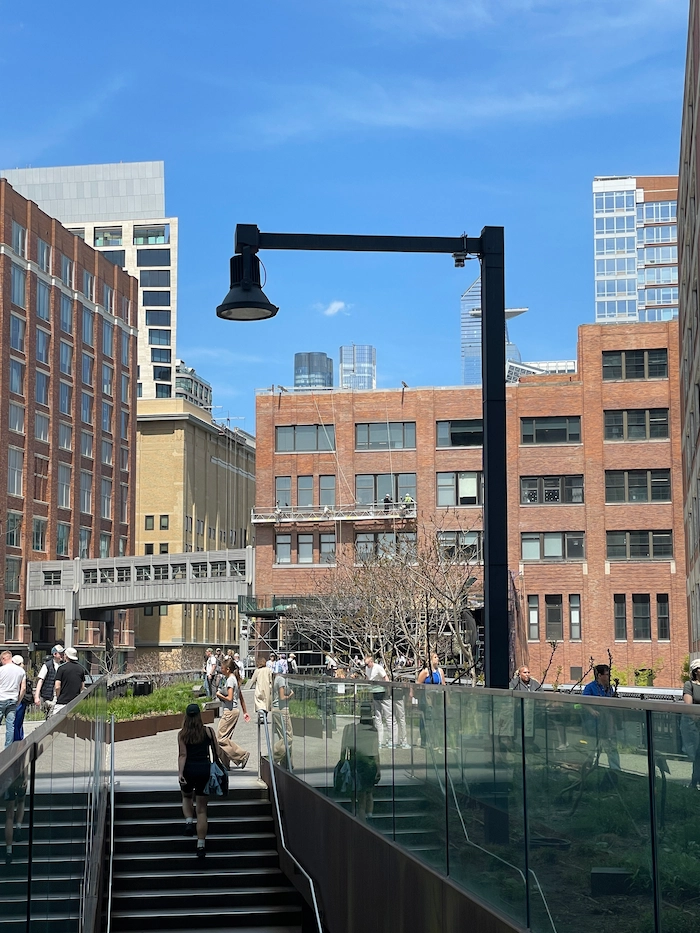 Outdoor people counting sensor mounted above a park pathway entrance — weatherproof and tamper-resistant for all-weather operation