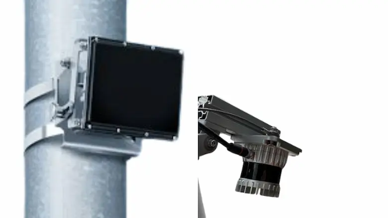 RADAR and LiDAR sensors mounted side by side on poles above a roadway